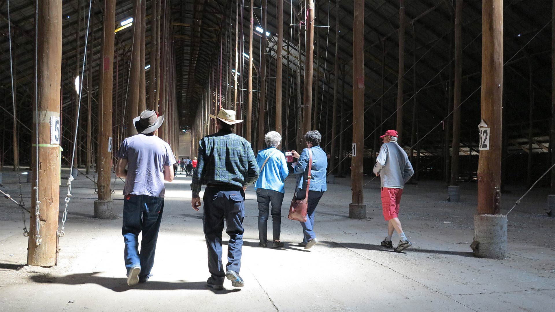 People walking in the Stick Shed.