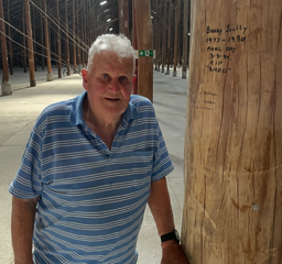 Barry Scully with his graffiti on the Shed's last day.