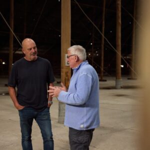 Andrew Daddo (l) talks to David Grigg.